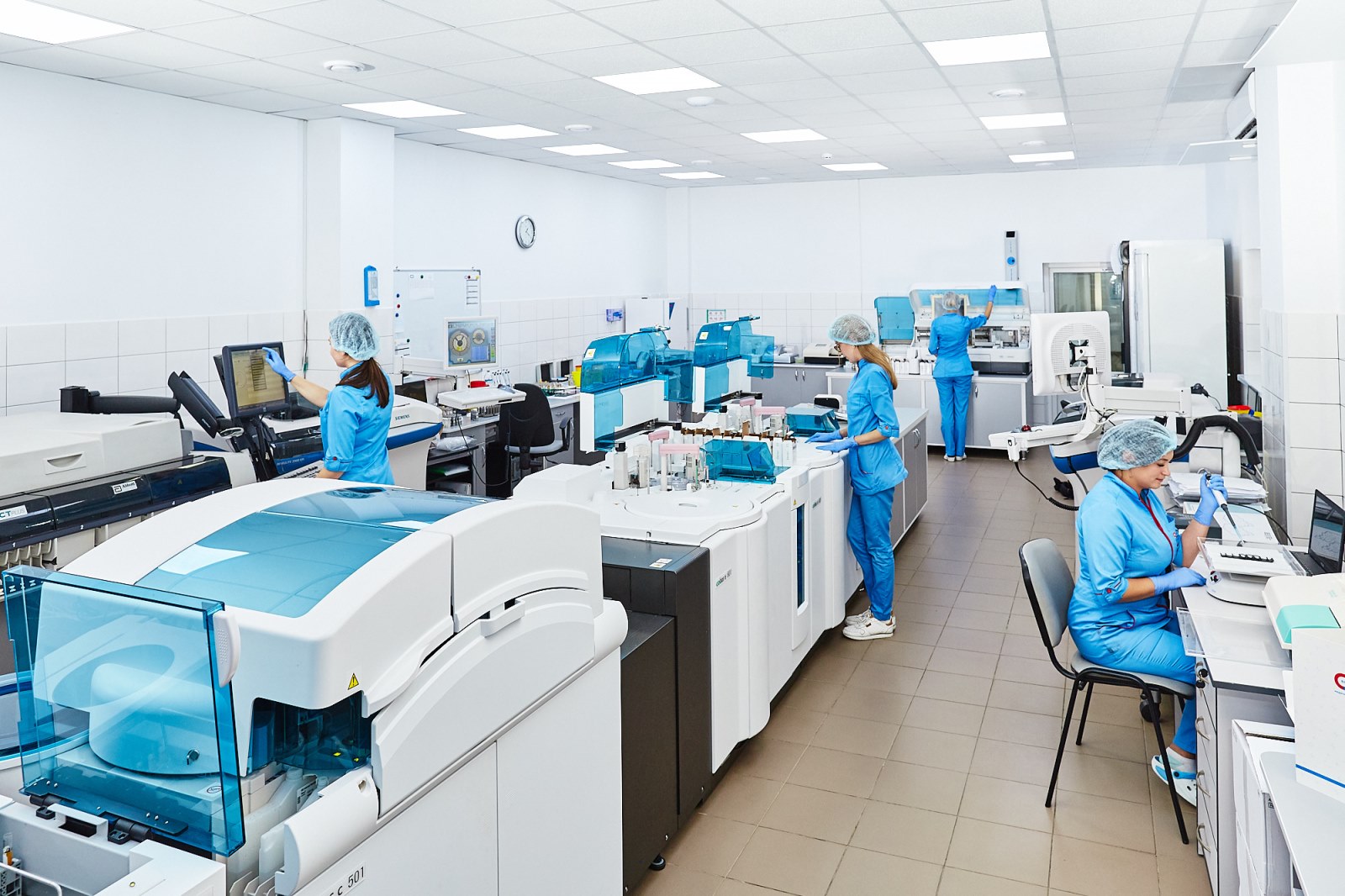 A group of scientists working together in a research laboratory.